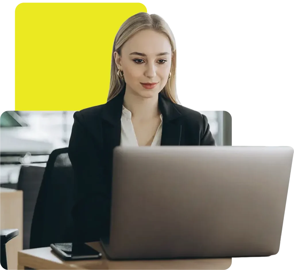Car dealer using her laptop to place a deal with an auto finance brokerage