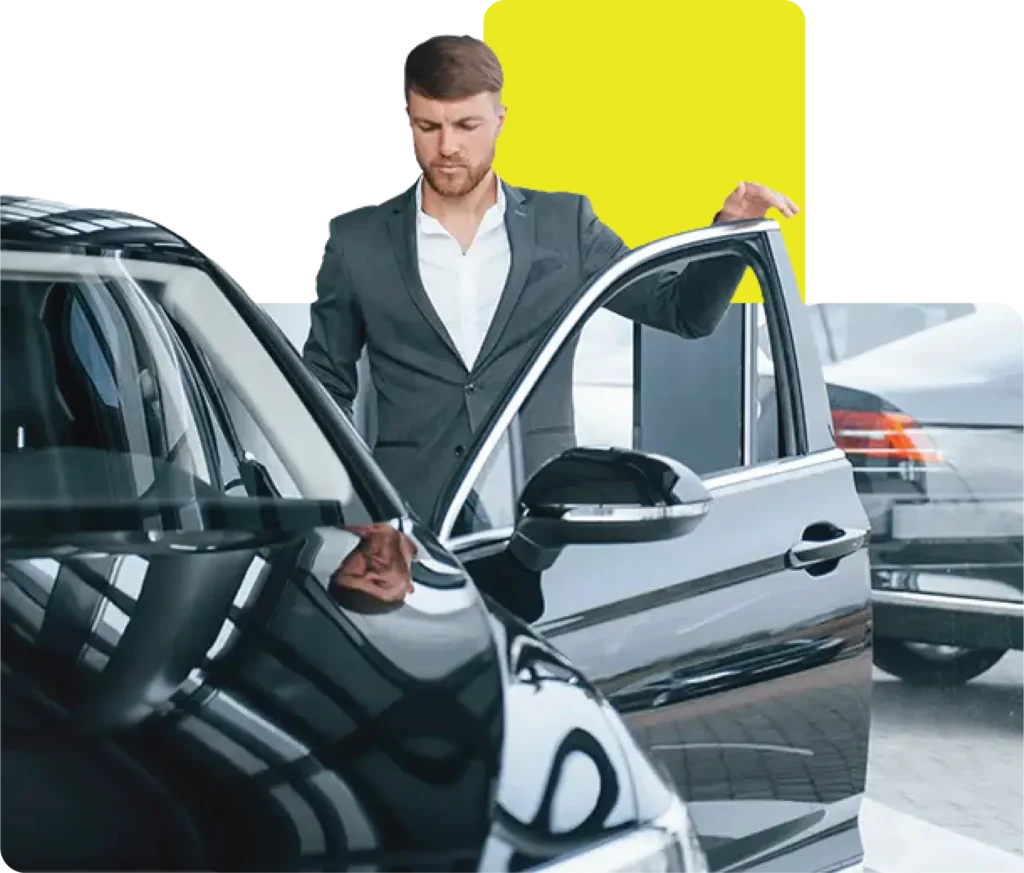 car dealer helping customer buy a car on finance