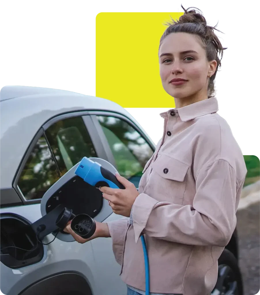 woman stood next to the electric car she bought on EV finance