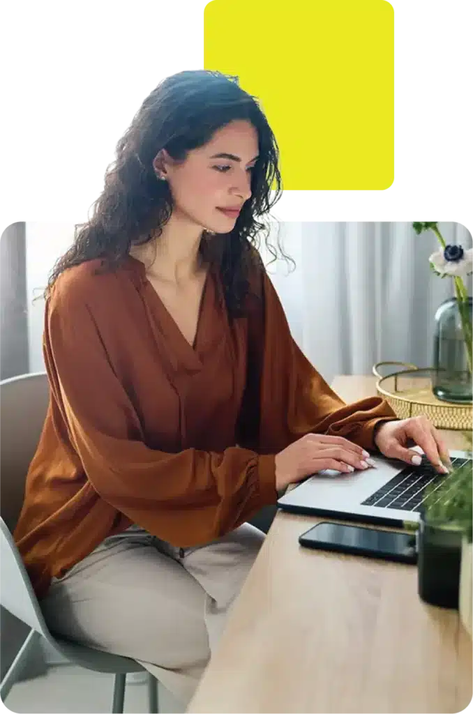 Woman using her laptop to get car finance advice at evolution funding