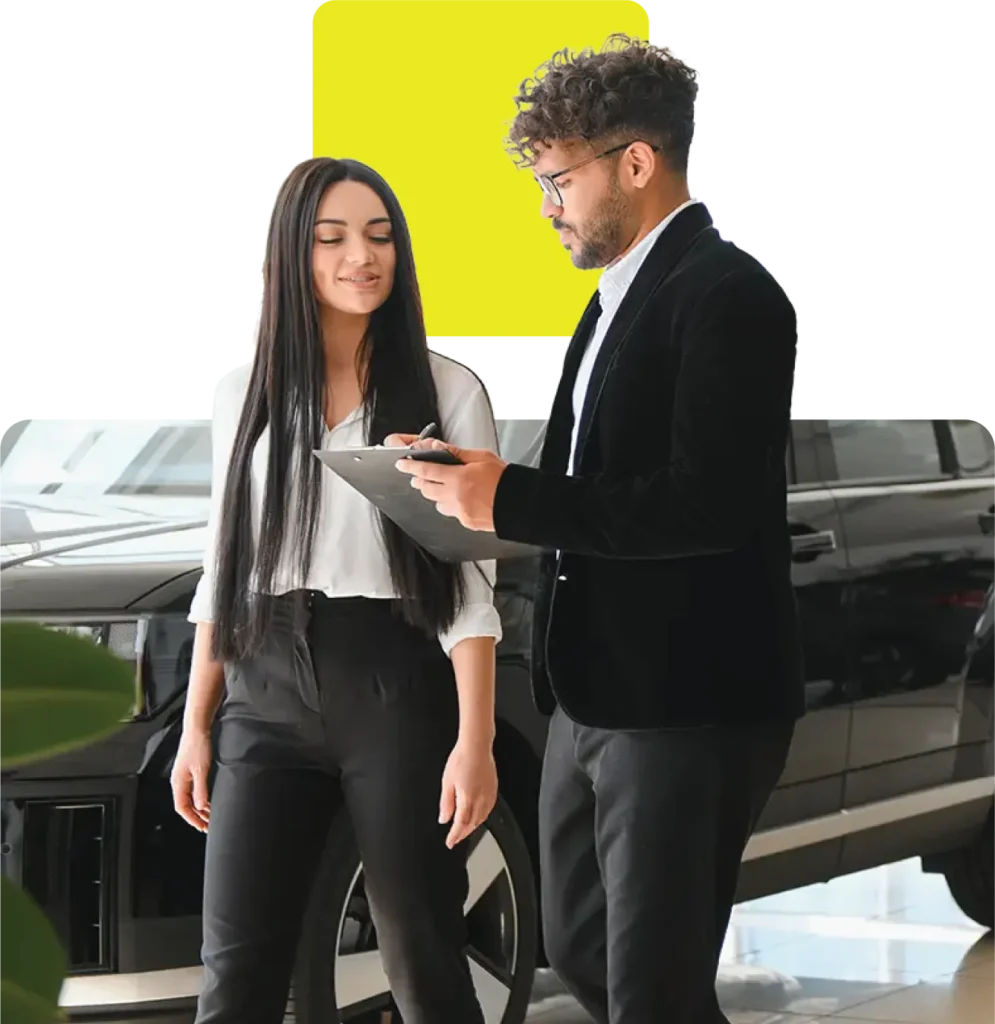 Car dealer taking details from customer for a car in finance