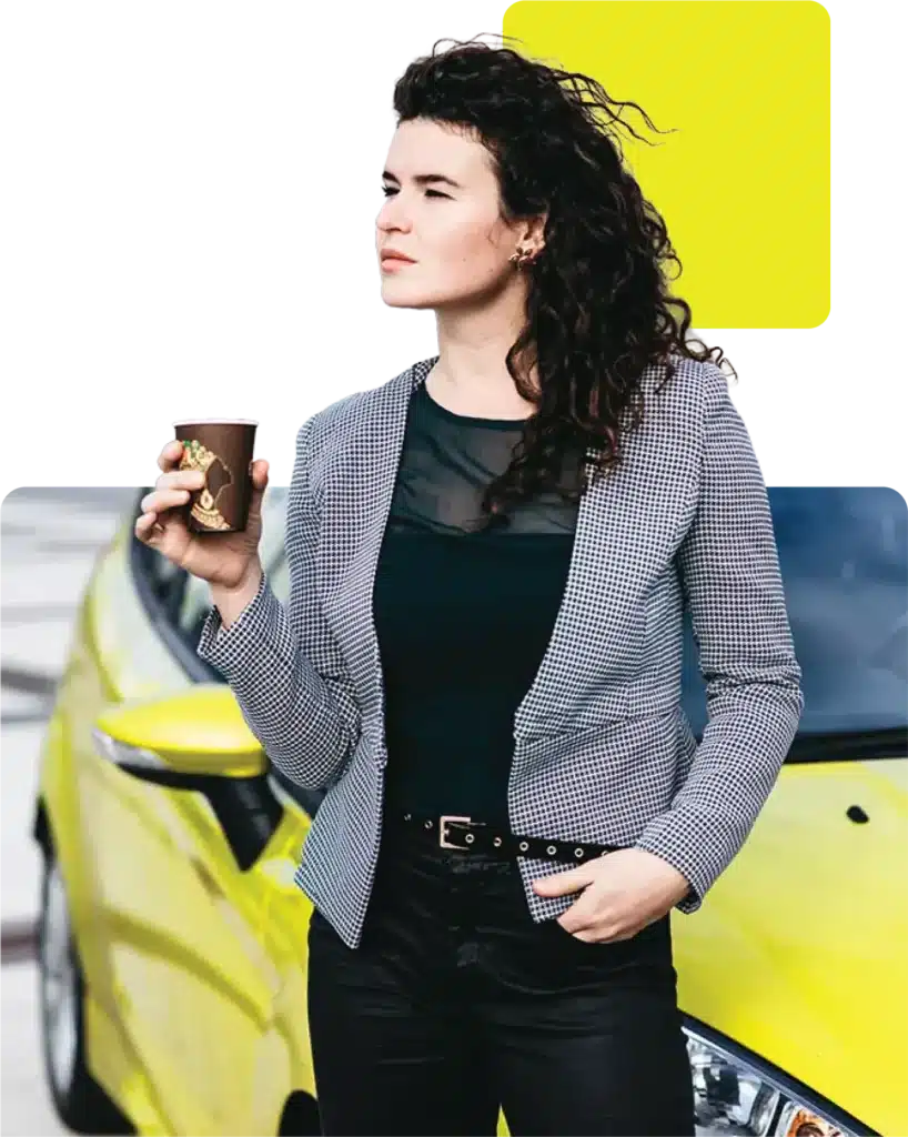 lady leaning against a yellow car that she bought using automotive finance