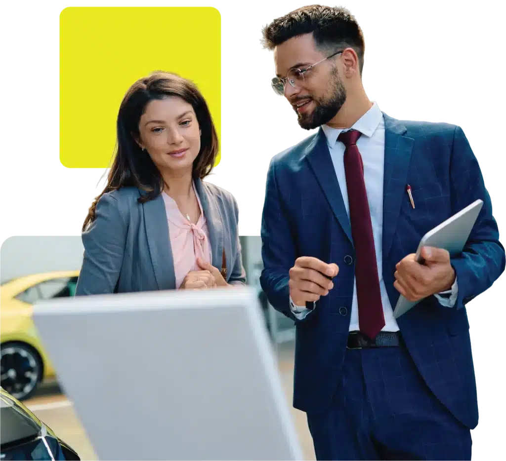Car dealers using an automotive finance platform in the showroom